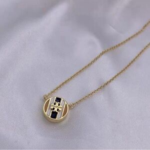 Tory Burch Elegant Gold and Black Pendant Necklace